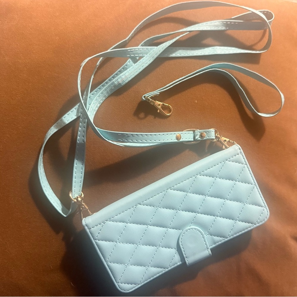 Quilted Light Blue Crossbody Wallet Bag for iPhone 16 Pro. Magnetic closure.
